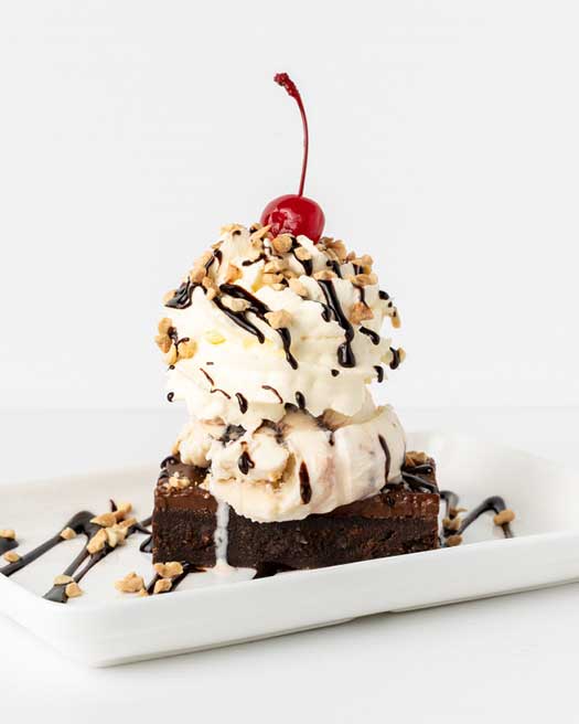 Brownie Sundae - Sunday 12th September Warm chocolate brownie topped with ice cream, fresh cream, hot fudge sauce, nuts, cherry and waffle wafer.