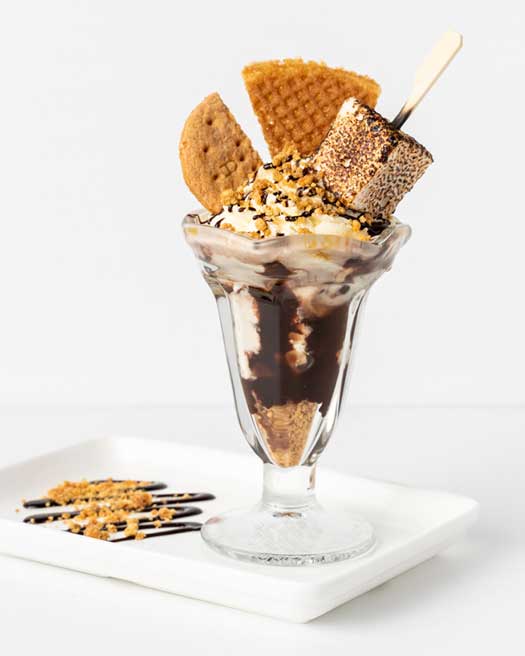 S'mores Sundae - Sunday 5th September Caramel cookie crunch, ice cream and fresh cream drizzled with hot fudge sauce and topped with waffle wafer, graham cookie and torched marshmallow.